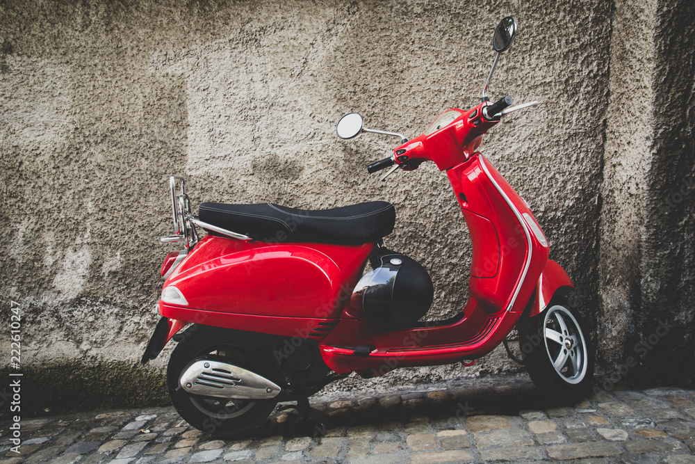 Red scooter parked on a street in Bern Switzerland