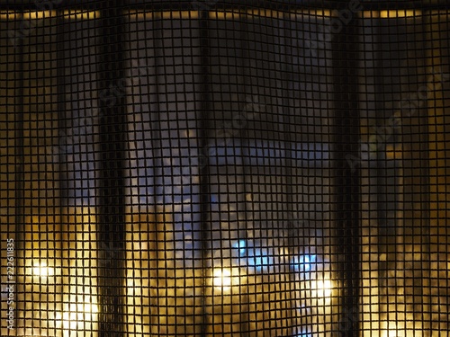 curtains looking like a net with an abstract night city background