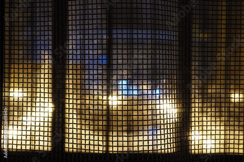 curtains looking like a net with an abstract night city background