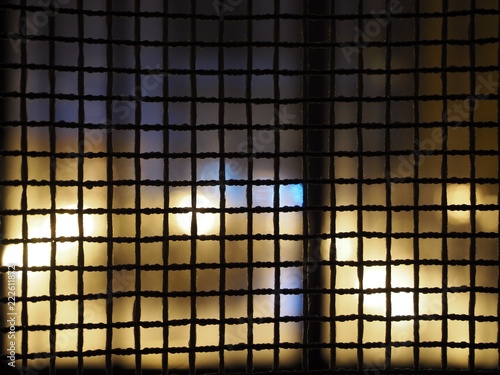 curtains looking like a net with an abstract night city background