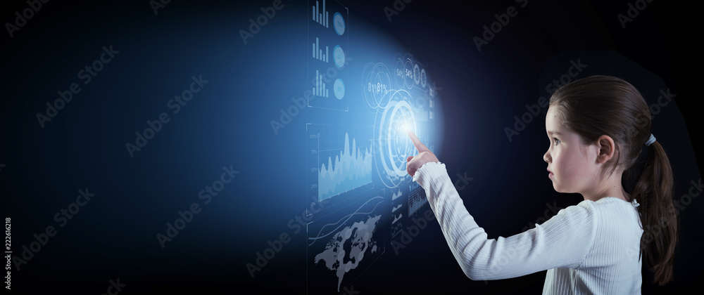 Little girl touching virtual interface button on dark background with copy space Little girl touching virtual interface button on dark background with copy space