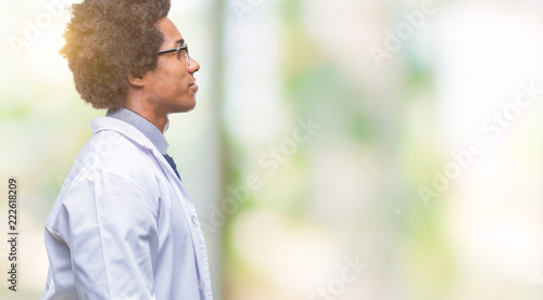 Afro american doctor scientist man over isolated background looking to side, relax profile pose with natural face with confident smile.