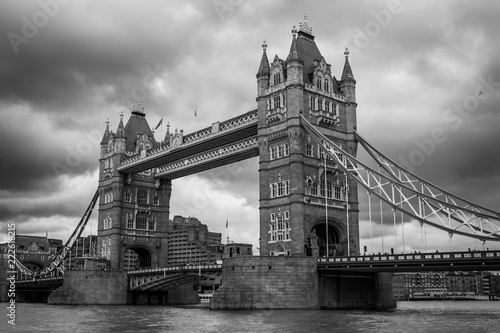 Tower Bridge and River Thames view in London, photo in black and white.