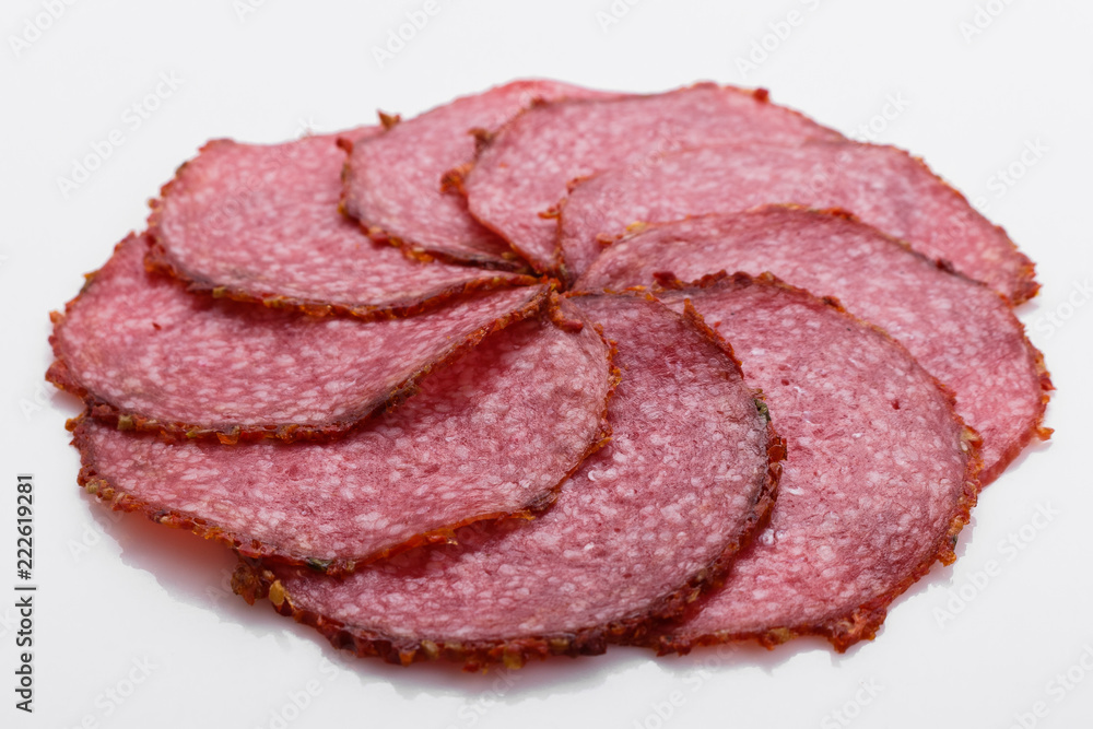 delicious sliced salami on a white background
