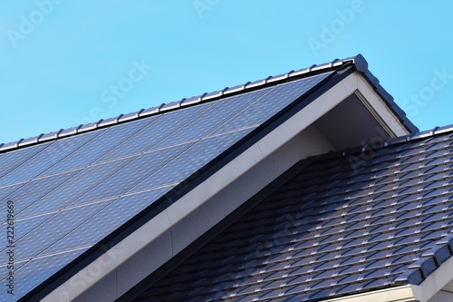 Solar panels fitted on modern house roof
