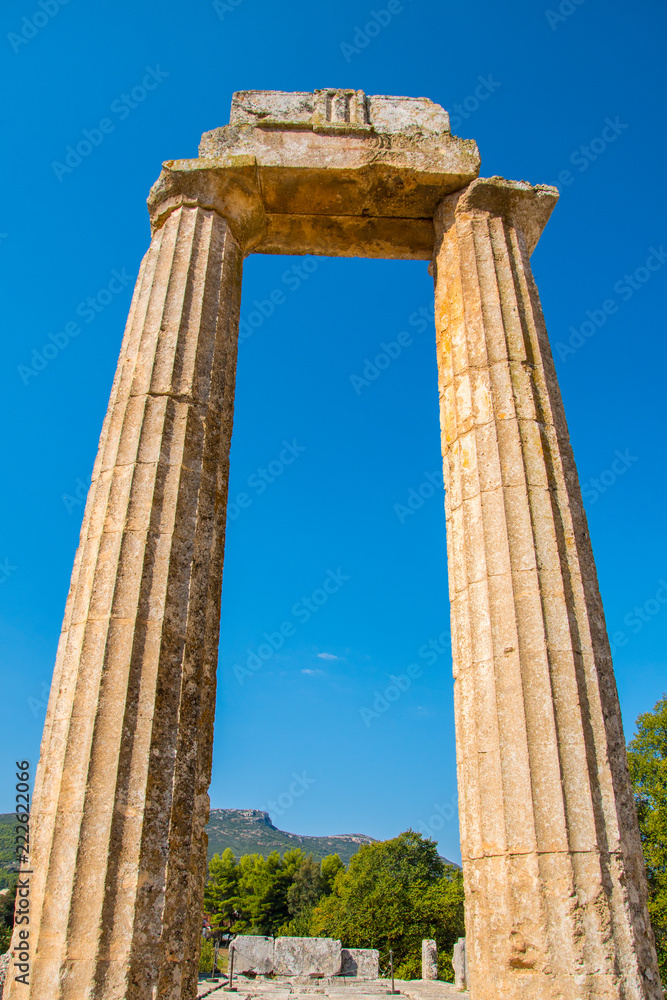 Close up of the columns of temple of Zeus at archaeological site of Nemea in Greece. It was built around 330 BC to serve the needs of the Nemian festival and games. 