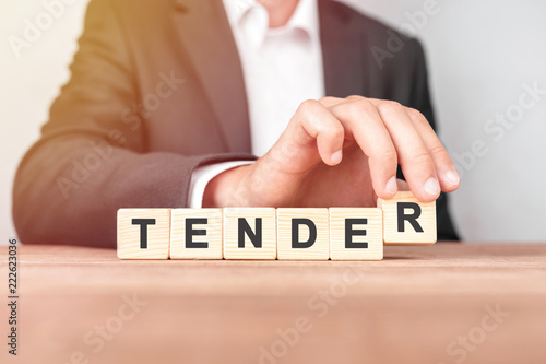 Fotografia Man made word TENDER with wood blocks