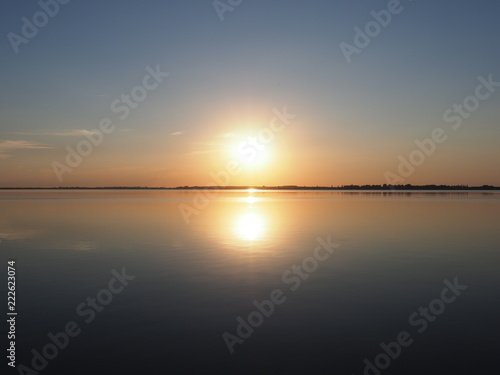 Spectacular sun set over artificial european Goczalkowice Reservoir in Poland with beauty blue sky on landscape © Jakub Korczyk