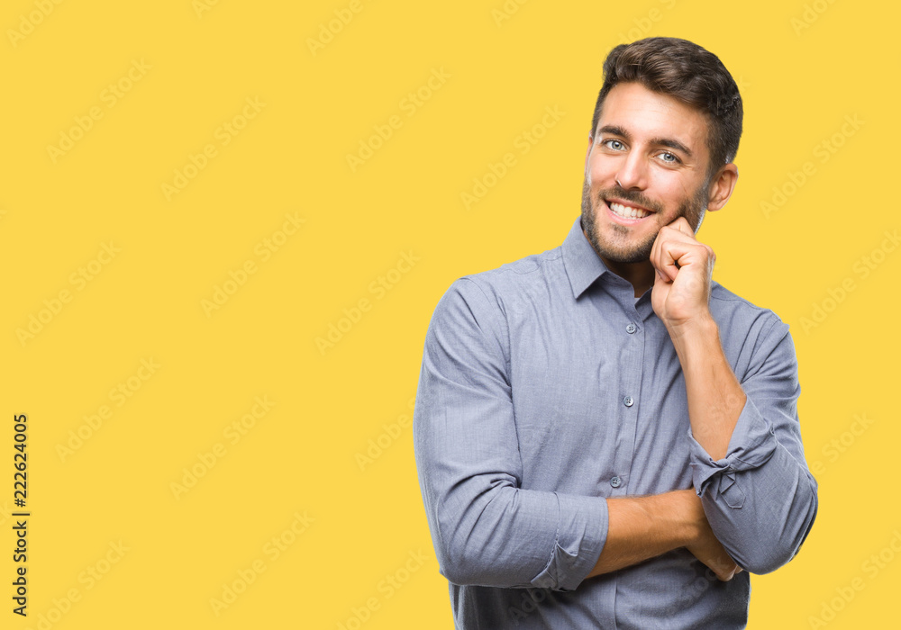 Young handsome man over isolated background with hand on chin thinking about question, pensive expression. Smiling with thoughtful face. Doubt concept. Young handsome man over isolated background with hand on chin thinking about question, pensive expression. Smiling with thoughtful face. Doubt concept.