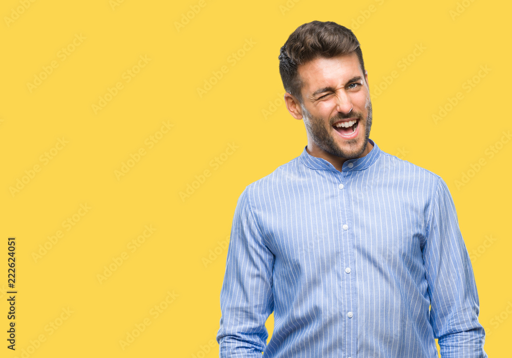 Young handsome man over isolated background winking looking at the camera with sexy expression, cheerful and happy face. Young handsome man over isolated background winking looking at the camera with sexy expression, cheerful and happy face.