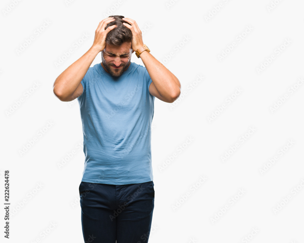 Young handsome man over isolated background suffering from headache desperate and stressed because pain and migraine. Hands on head. Young handsome man over isolated background suffering from headache desperate and stressed because pain and migraine. Hands on head.