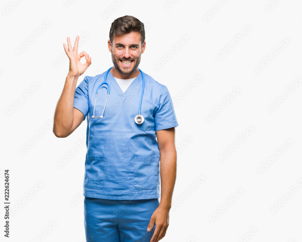 Young handsome doctor surgeon man over isolated background smiling positive doing ok sign with hand and fingers. Successful expression. Young handsome doctor surgeon man over isolated background smiling positive doing ok sign with hand and fingers. Successful expression.