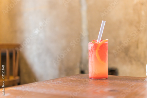 grapefruit juice on wooden table