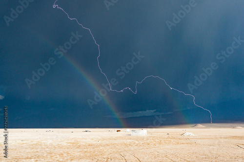 rainbow and storm on mountain highland