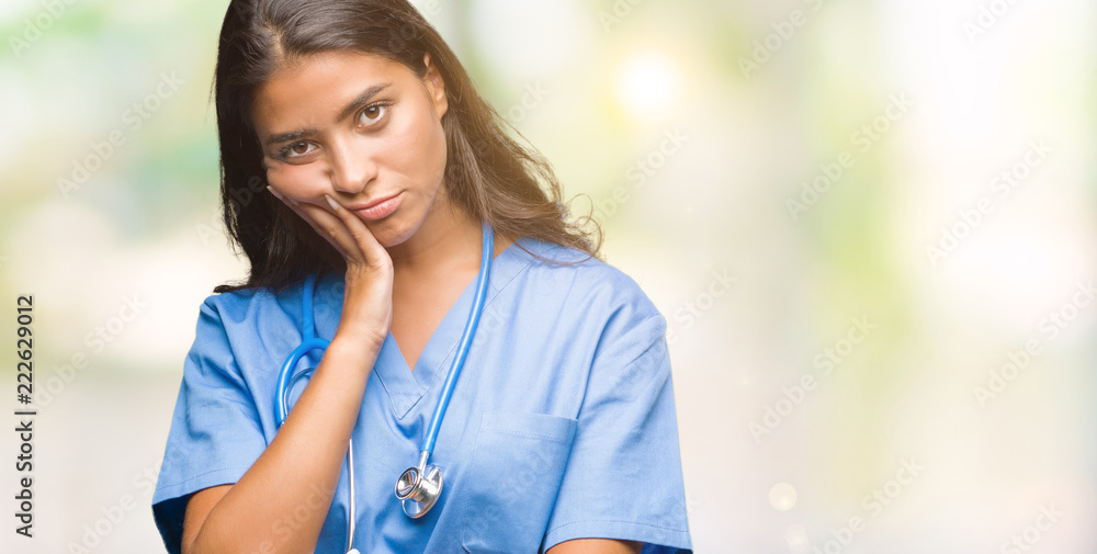 Young arab doctor surgeon woman over isolated background thinking looking tired and bored with depression problems with crossed arms. Young arab doctor surgeon woman over isolated background thinking looking tired and bored with depression problems with crossed arms.