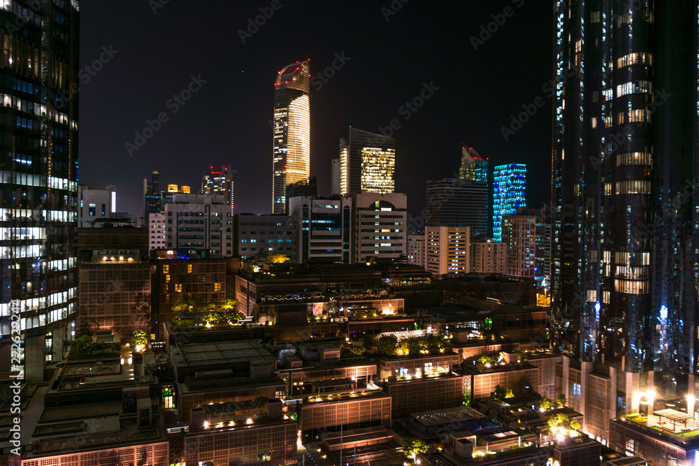 Abu Dhabi city towers and skyline at night - World trade center and the mall