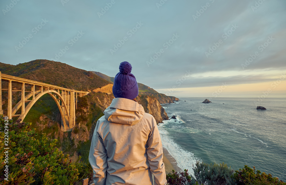 Woman tourist near Bixby Creek Bridge in California