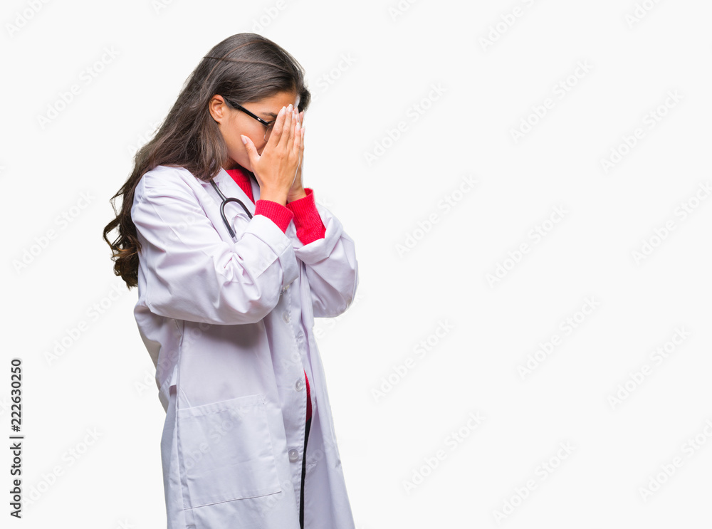 Young arab doctor woman over isolated background with sad expression covering face with hands while crying. Depression concept. Young arab doctor woman over isolated background with sad expression covering face with hands while crying. Depression concept.