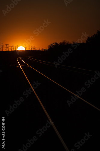 Railroad Tracks Lit During a Golden Summer Sunset