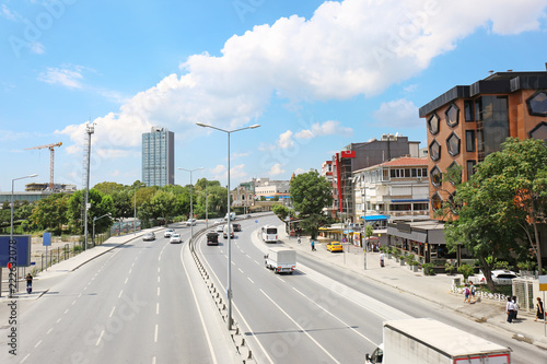 Beautiful city street with cars on sunny day © New Africa