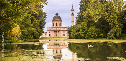 Schwetzingen Castle. Red mosque in the castle garden, in the foreground the lake with swan. Schwetzingen, Baden-Wuerttemberg, Germany, Europe photo