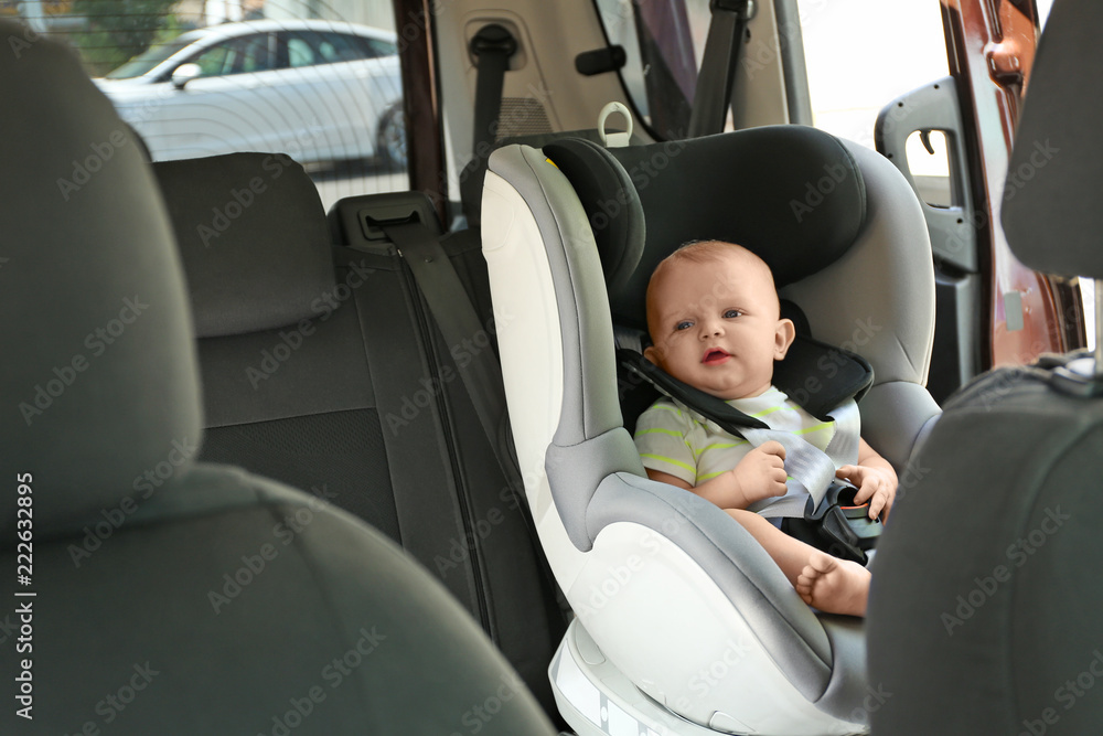 Little baby in child safety seat inside of car Little baby in child safety seat inside of car