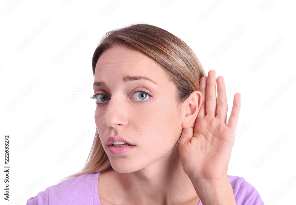 Young woman with hearing problem on white background Young woman with hearing problem on white background