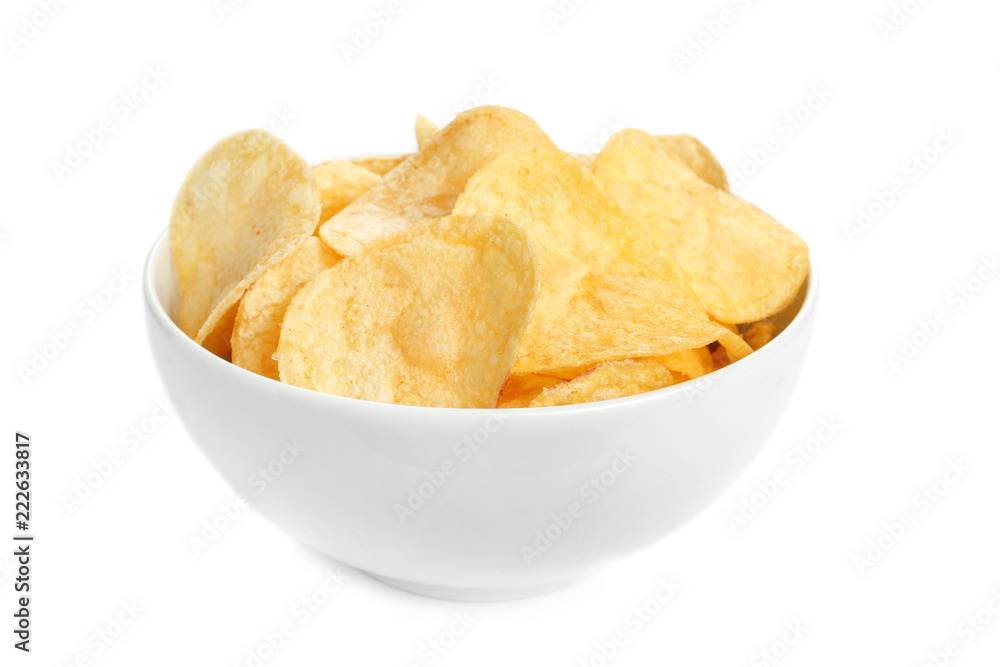 Bowl of tasty crispy potato chips on white background