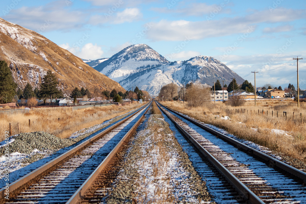 Two Tracks Leading to Mountains in Winter Two Tracks Leading to Mountains in Winter