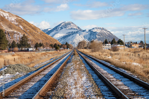 Two Tracks Leading to Mountains in Winter