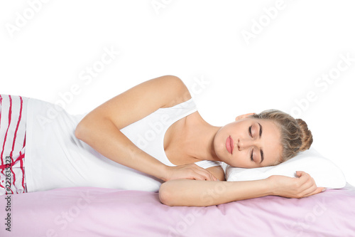 Beautiful woman sleeping with orthopedic pillow on bed against white background