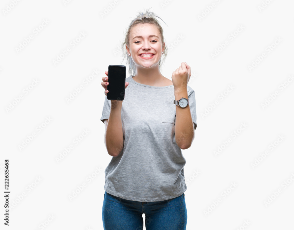 Young blonde woman showing screen of smartphone over isolated background screaming proud and celebrating victory and success very excited, cheering emotion Young blonde woman showing screen of smartphone over isolated background screaming proud and celebrating victory and success very excited, cheering emotion