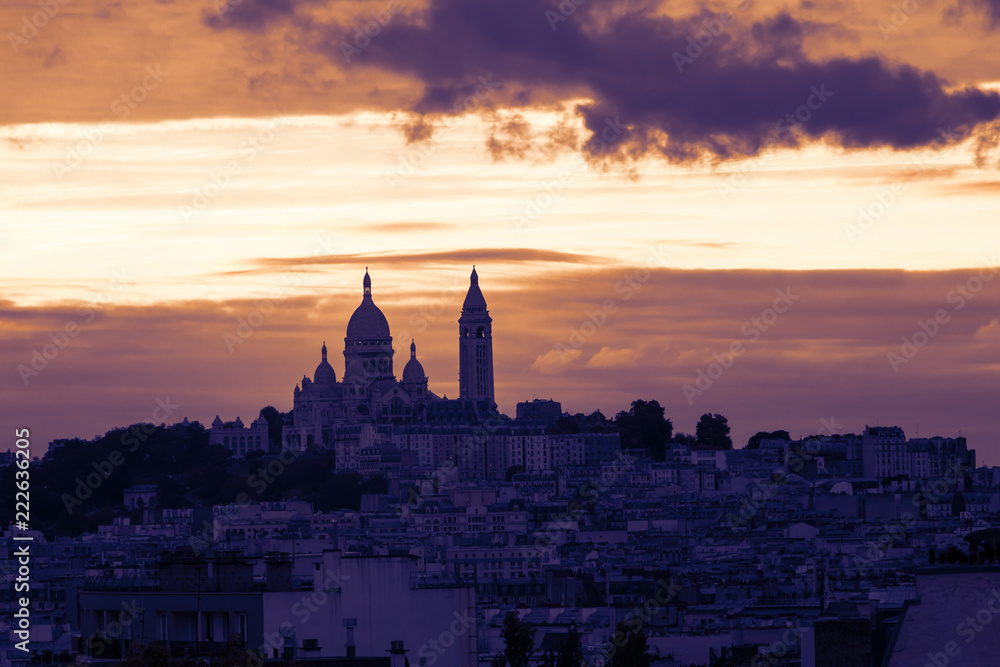 View on Montmartre hill in 18th arrondissement of Paris. Skyline and Basilics of the Sacre Coeur. Selective focus.