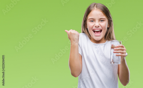 Fotografie, Tablou Young beautiful girl drinking glass of water over isolated background screaming