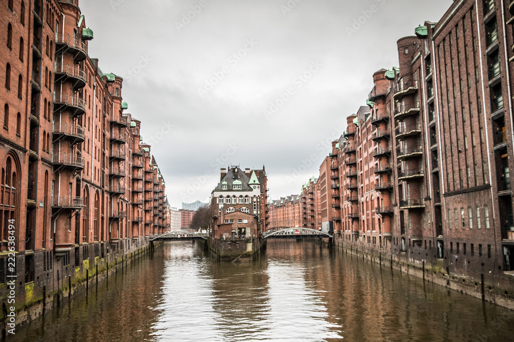 Red buildings over the canals in historic warehouse district in Hamburg, Germany