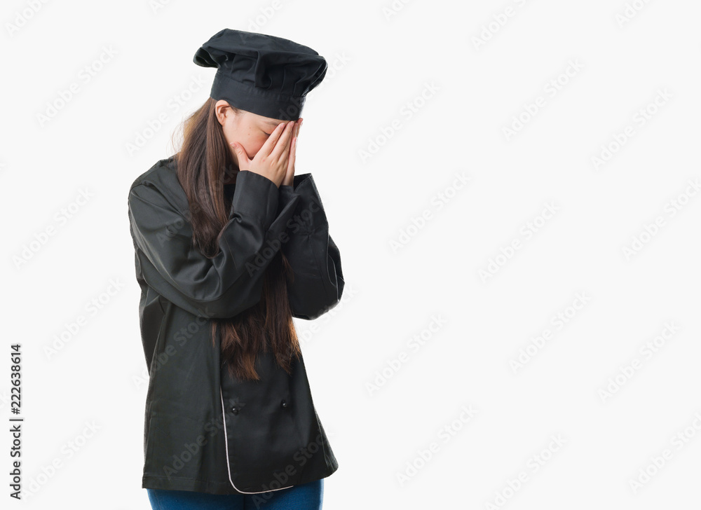 Young Chinese woman over isolated background wearing chef uniform with sad expression covering face with hands while crying. Depression concept. Young Chinese woman over isolated background wearing chef uniform with sad expression covering face with hands while crying. Depression concept.