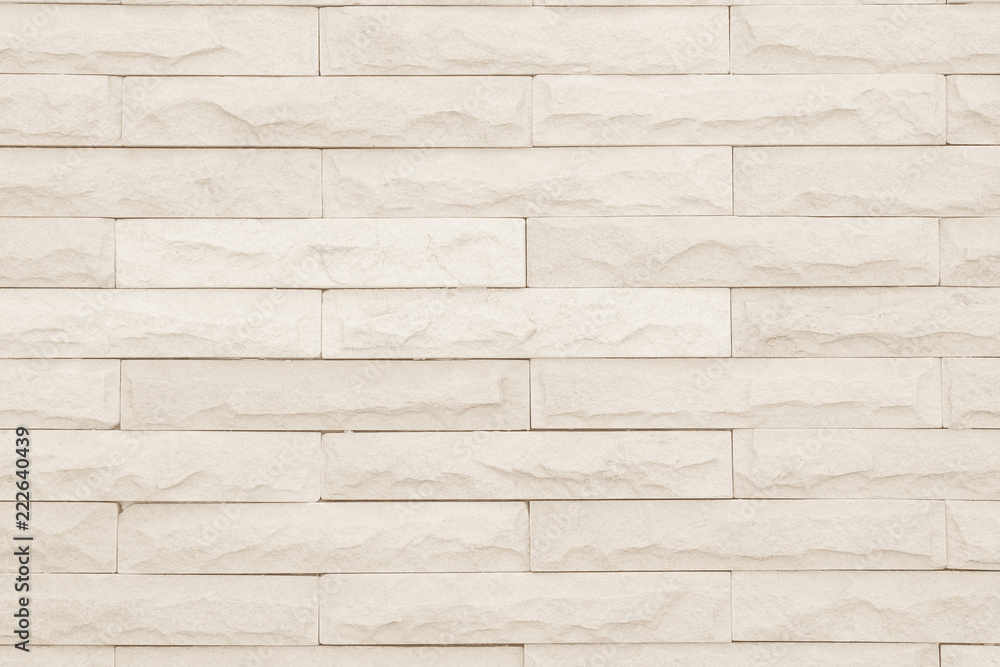 Seamless Cream pattern of decorative brick sandstone wall surface with concrete of modern style design decorative uneven have cracked realmasonry wall of multicolored stones or blocks with cement. Seamless Cream pattern of decorative brick sandstone wall surface with concrete of modern style design decorative uneven have cracked realmasonry wall of multicolored stones or blocks with cement.