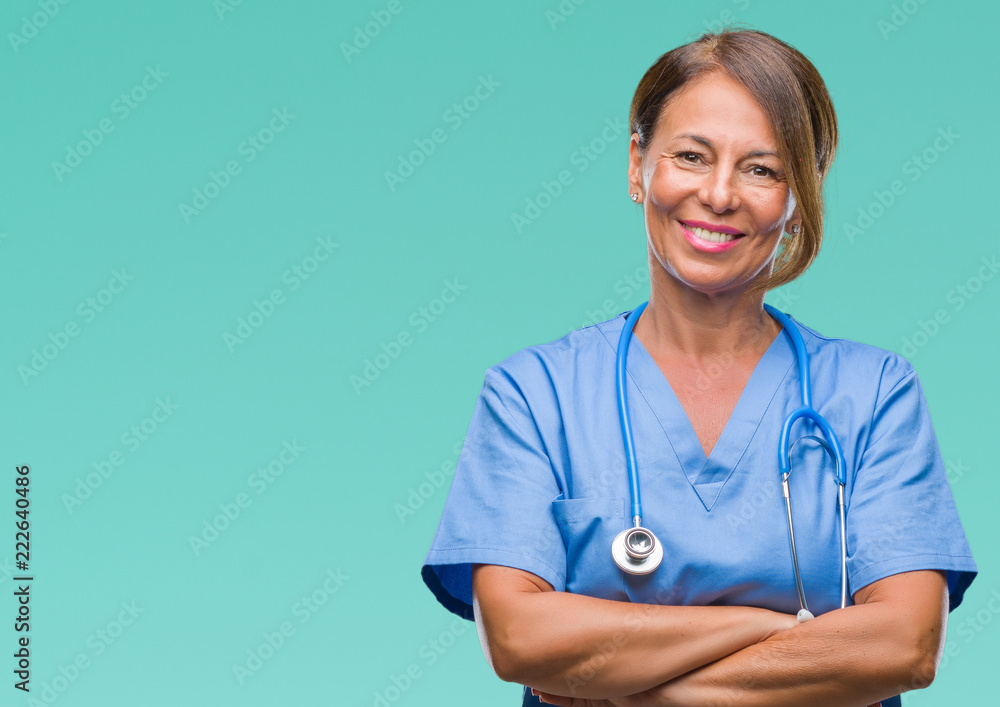 Middle age senior nurse doctor woman over isolated background happy face smiling with crossed arms looking at the camera. Positive person. - obrazy, fototapety, plakaty 