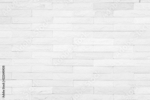 Seamless White pattern of decorative brick sandstone wall surface with concrete of modern style design decorative uneven have cracked realmasonry wall of multicolored stones or blocks with cement.