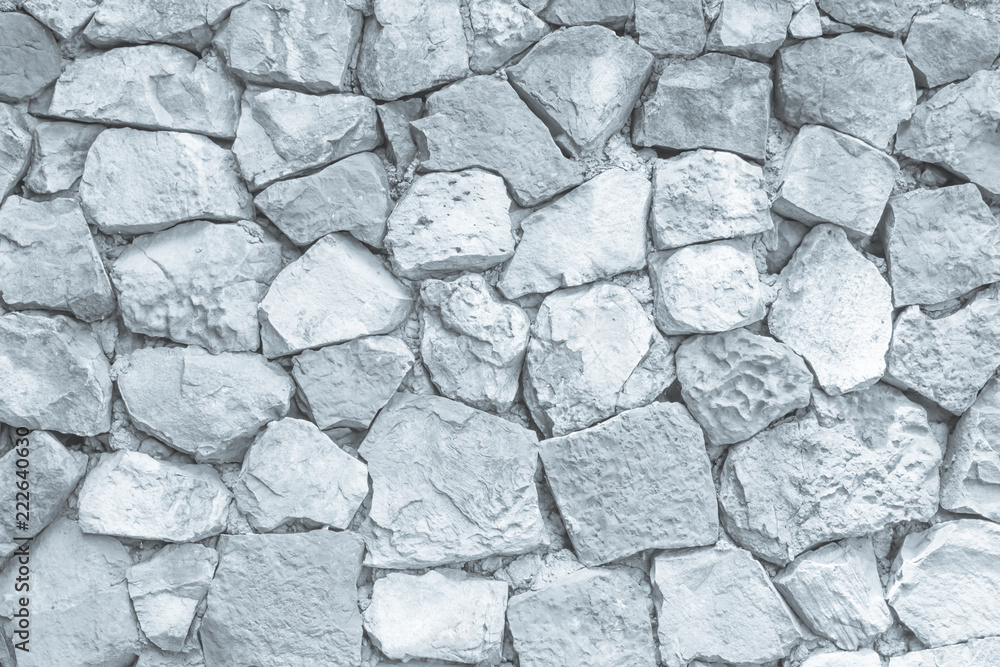 Seamless white pattern of decorative grey slate stone wall surface of modern style design decorative uneven cracked realmasonry wall of multicolored stones or blocks with cement or sandstone. Seamless white pattern of decorative grey slate stone wall surface of modern style design decorative uneven cracked realmasonry wall of multicolored stones or blocks with cement or sandstone.