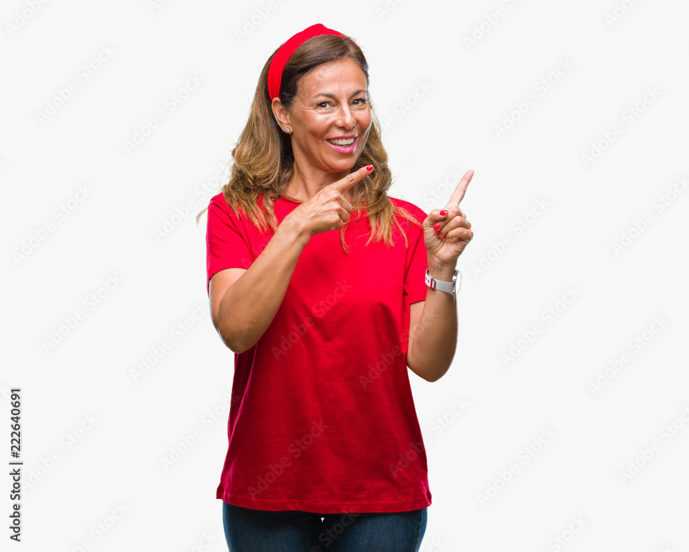 Middle age senior hispanic woman over isolated background smiling and looking at the camera pointing with two hands and fingers to the side. Middle age senior hispanic woman over isolated background smiling and looking at the camera pointing with two hands and fingers to the side.