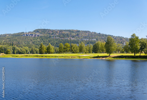 Oslo Bogstad lake in summer with a view of the golf course.