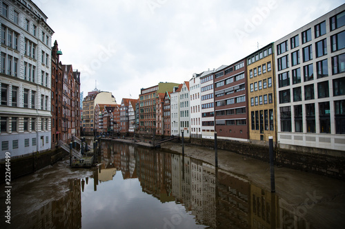 Colorful buildings reflecting on a canal in Hamburg, Germany © Ilias Kouroudis