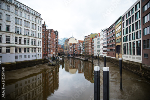 Colorful buildings reflecting on a canal in Hamburg, Germany