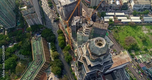 Thailand Bangkok Aerial v154 Looking above cityscape construction to panning birdseye 3/18 photo