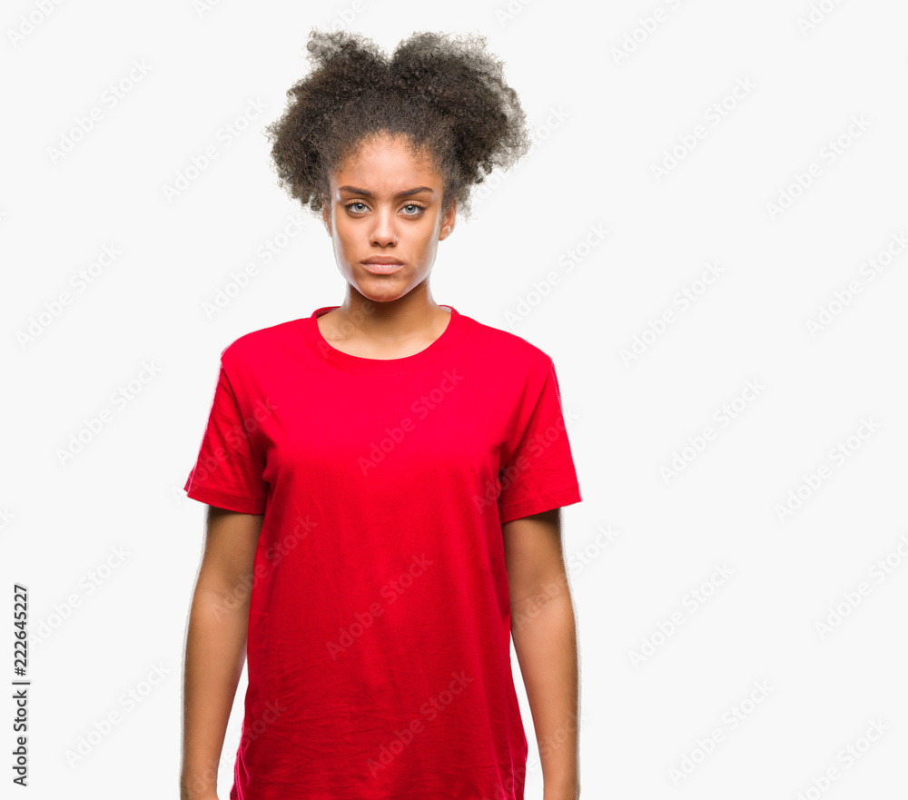 Young afro american woman over isolated background skeptic and nervous, frowning upset because of problem. Negative person. Young afro american woman over isolated background skeptic and nervous, frowning upset because of problem. Negative person.