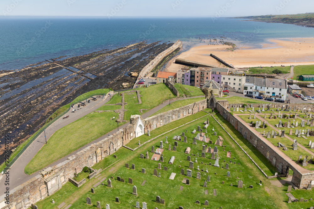Naklejka premium Aerial view Ruins and graveyard St Andrews cathedral near coast of North Sea, Scotland
