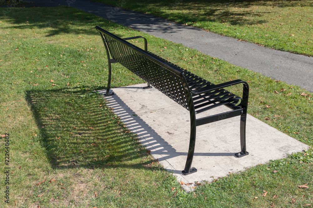 Bench with shadow behind.