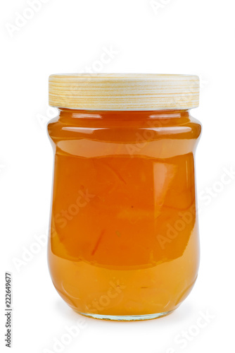 Homemade orange jam in glass jar isolated on white background