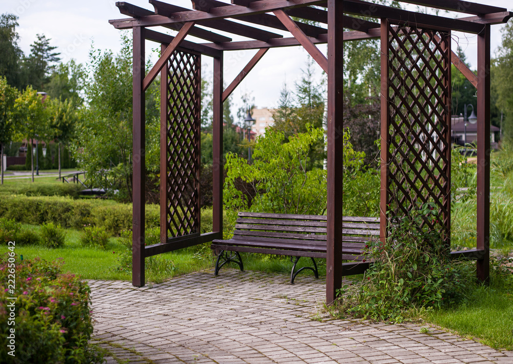 wooden gazebo in the Park, sitting area with wooden arbor